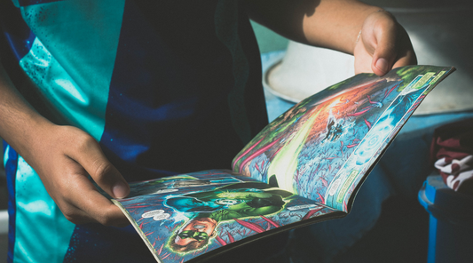 an image of a person looking at an open comic book